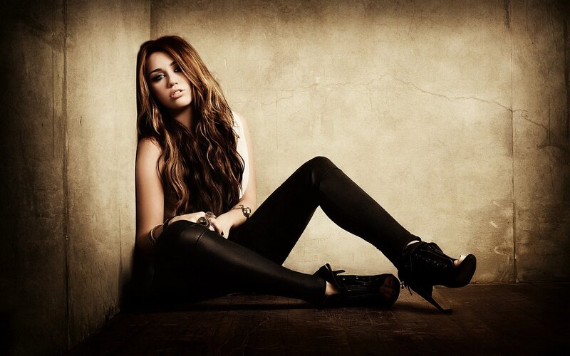 woman sitting in a corner