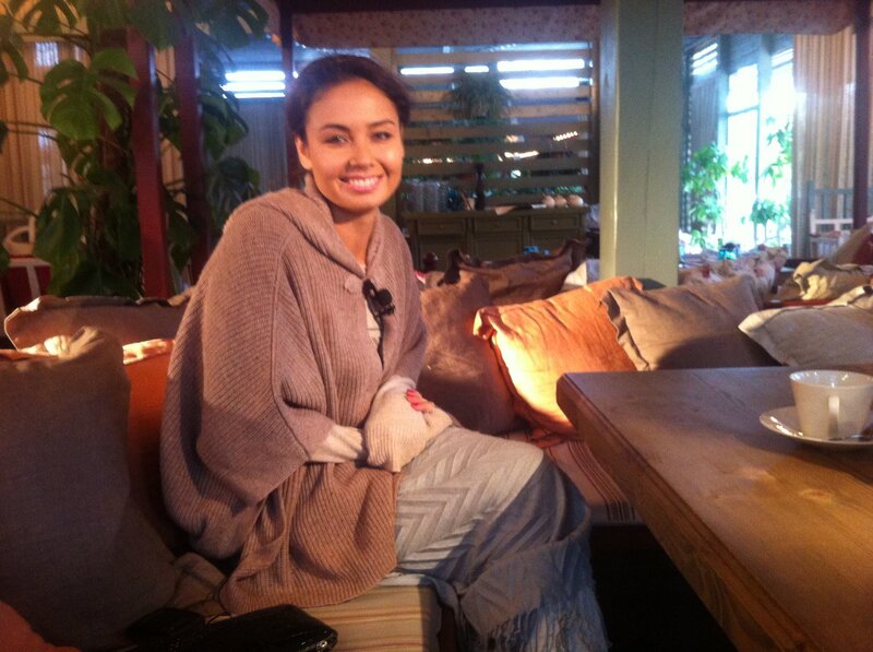 woman sitting in a cozy cafe