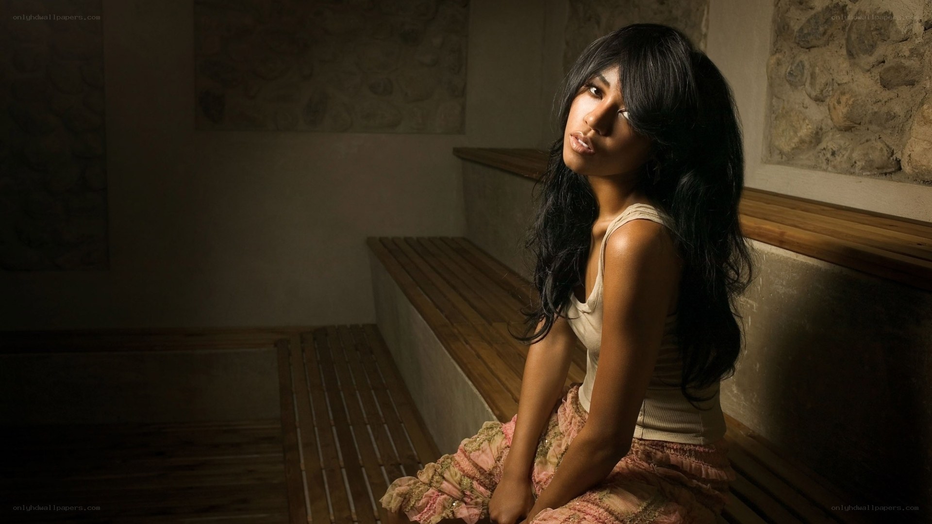 woman sitting in a dimly lit room
