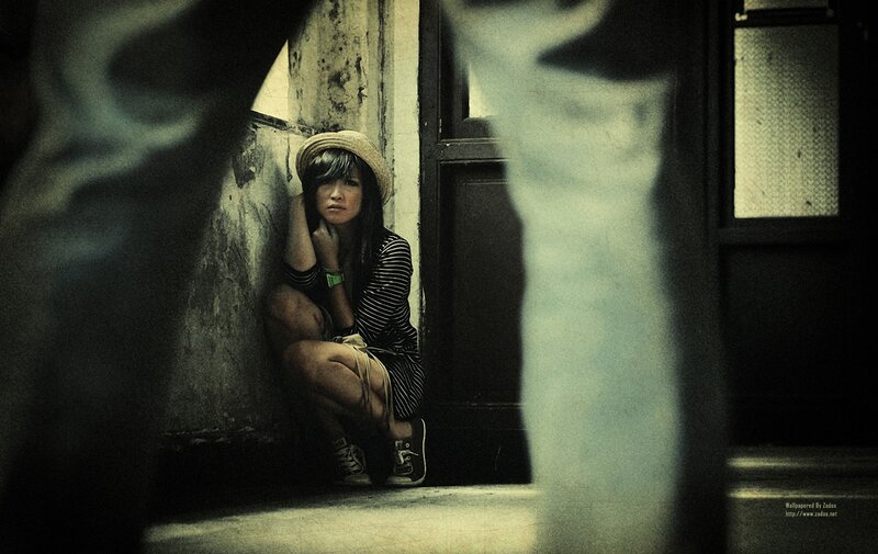 woman sitting in a doorway