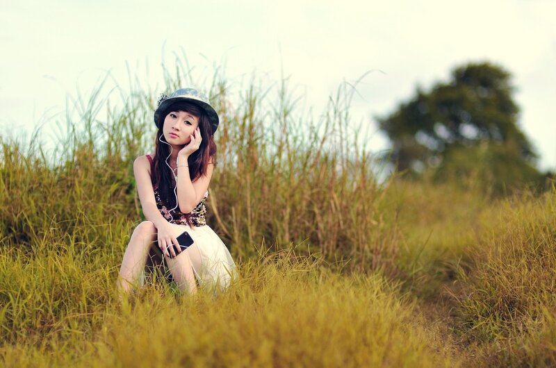 woman sitting in a field