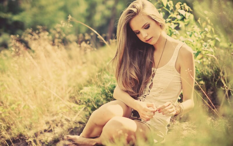 woman sitting in a field