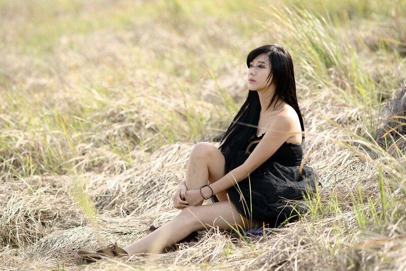woman sitting in a field
