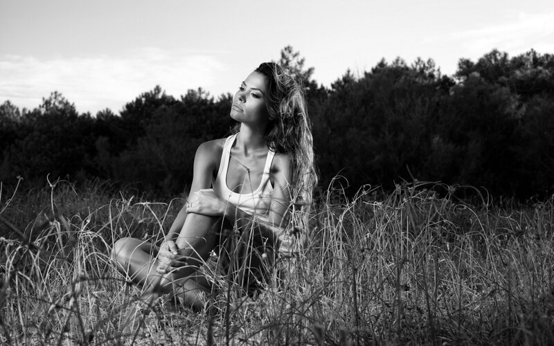 woman sitting in a field