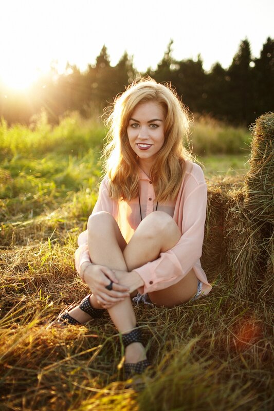 woman sitting in a field