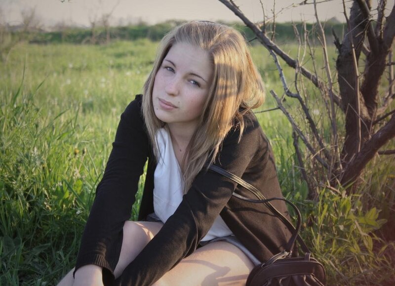 woman sitting in a field