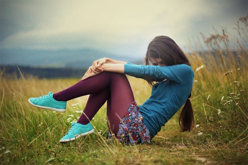woman sitting in a field