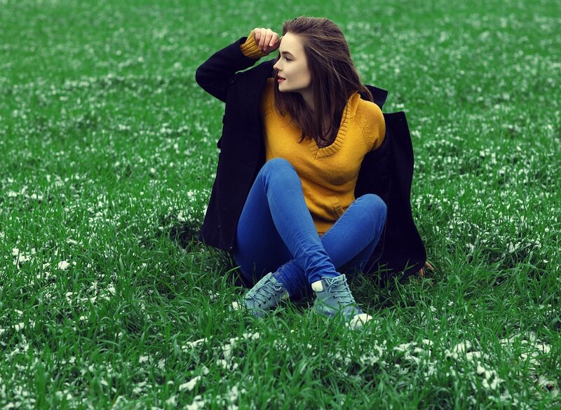 woman sitting in a field