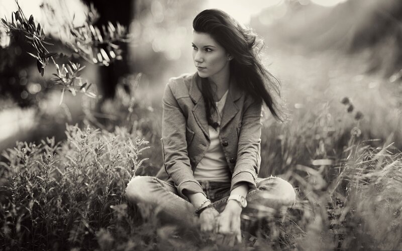 woman sitting in a field