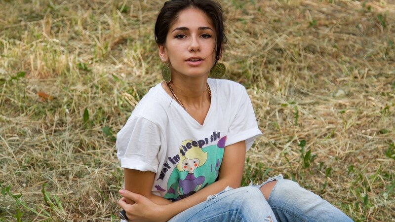 woman sitting in a field