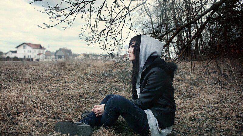 woman sitting in a field