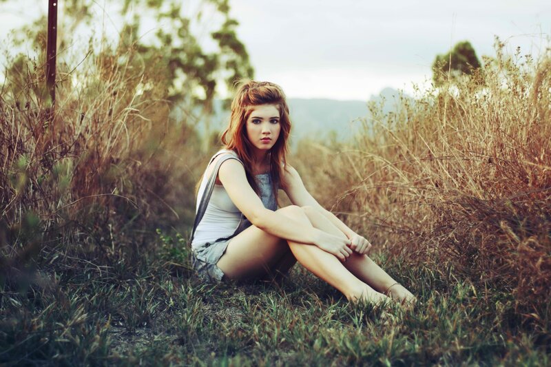 woman sitting in a field
