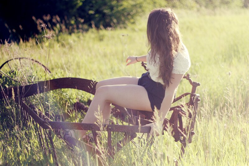woman sitting in a field