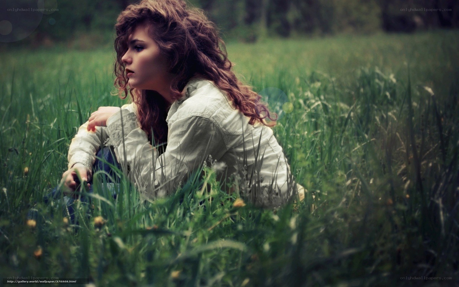 woman sitting in a field