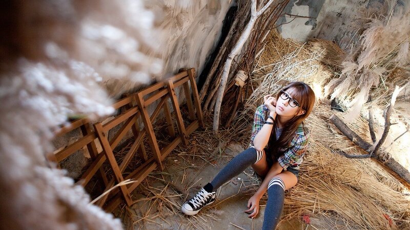 woman sitting in a rustic setting