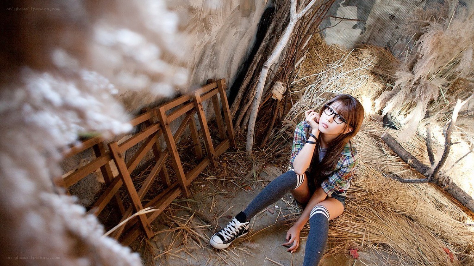 woman sitting in a rustic setting