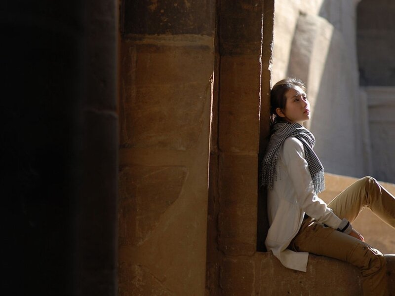woman sitting in a sunlit corner
