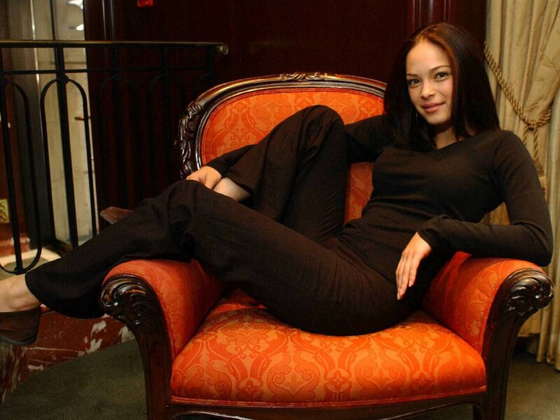 Woman Sitting in Armchair — Orange