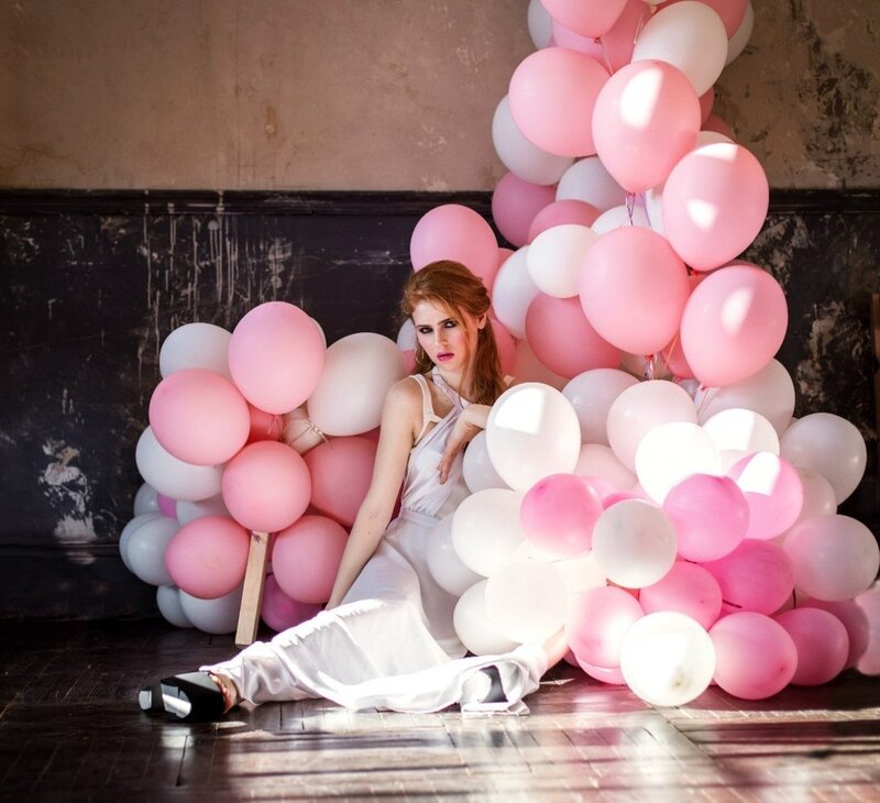 Woman Sitting in Balloons