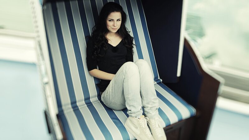 woman sitting in beach chair