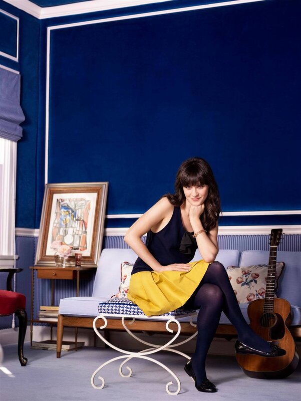 woman sitting in blue room