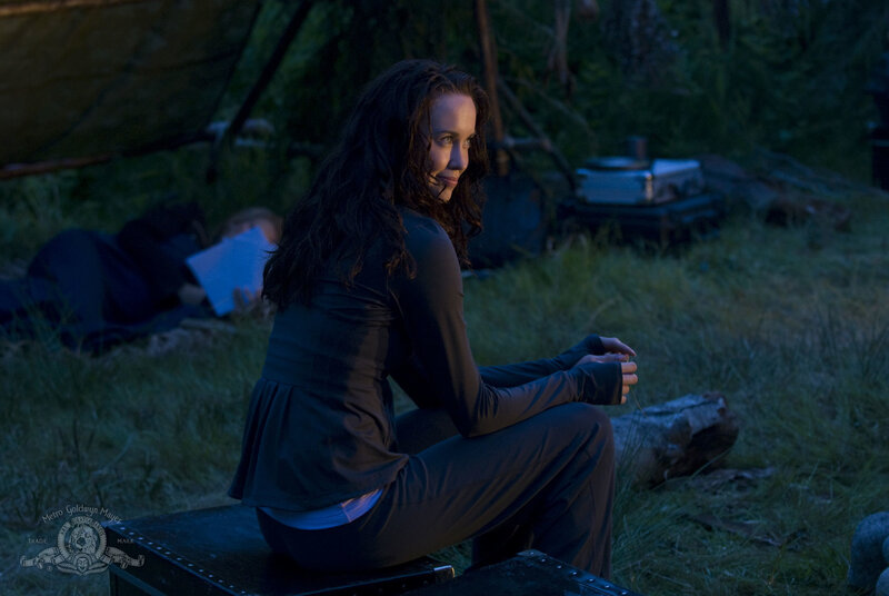 woman sitting in camp at night