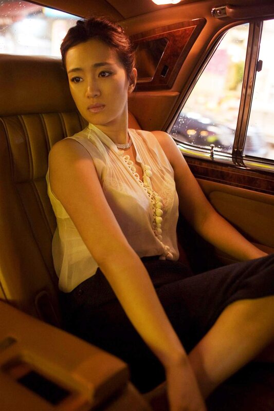 woman sitting in car at night