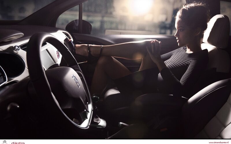 Woman Sitting in Car — Black, Dramatic