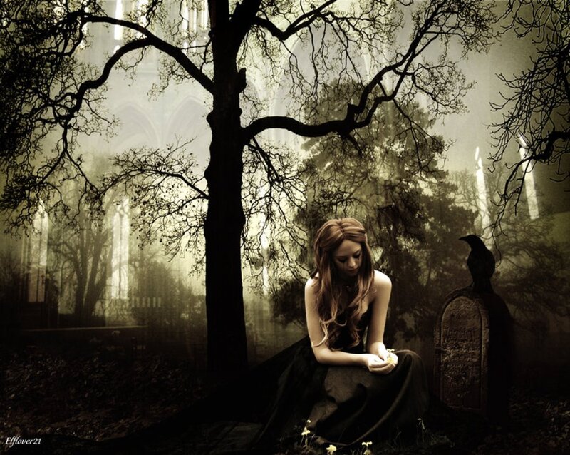 Woman Sitting in Cemetery