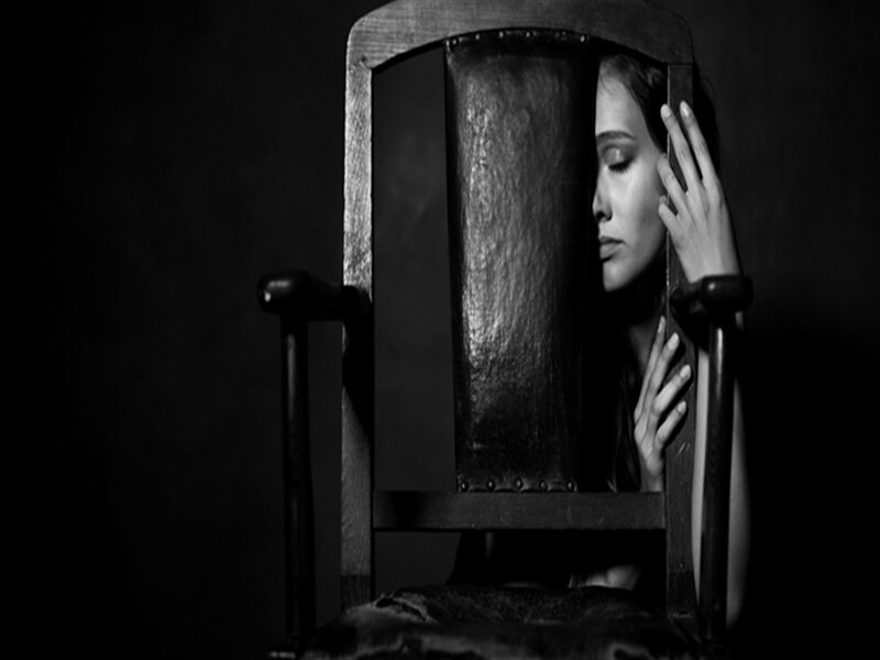 Woman Sitting in Chair — Black, Dramatic, Photograph, Hand