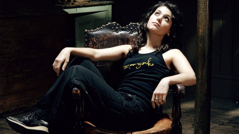 Woman Sitting in Chair — Black, Dramatic, Photograph, Sneakers