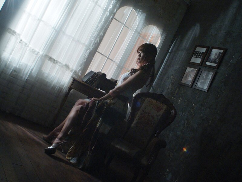Woman Sitting in Chair — Gray, Dramatic