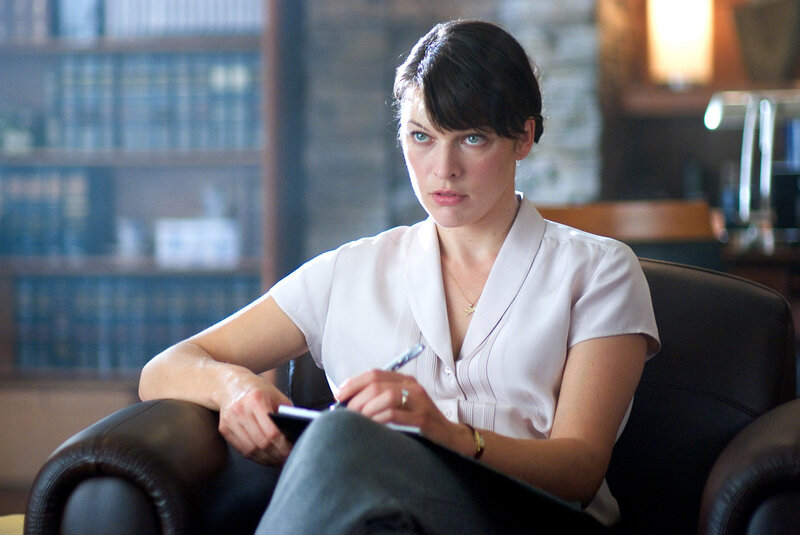 Woman Sitting in Chair — White, Serious, Photograph