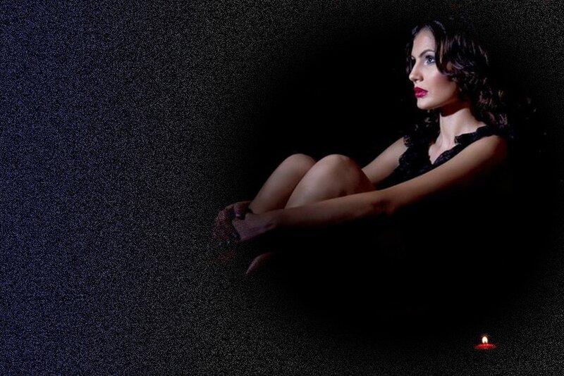 Woman Sitting in Darkness — Black