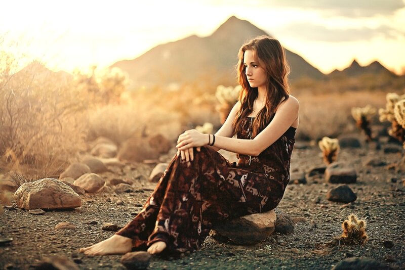 Woman Sitting in Desert — Brown, Serene