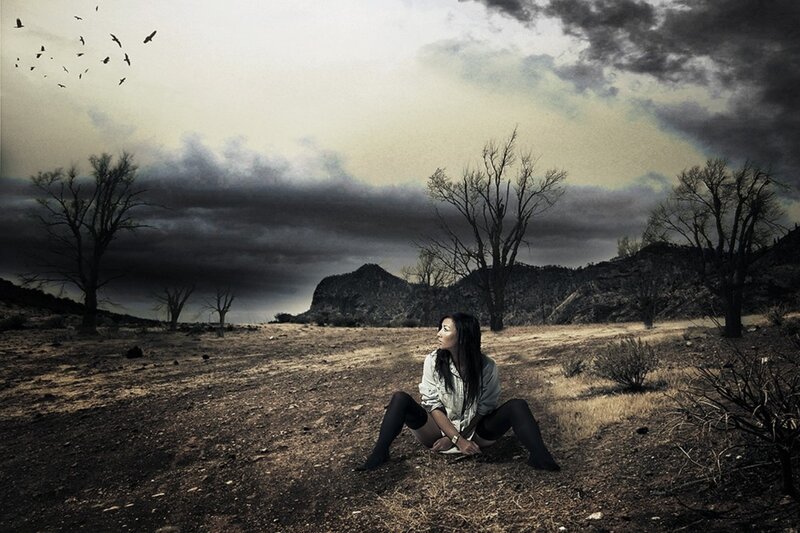 Woman Sitting in Desert — Brown