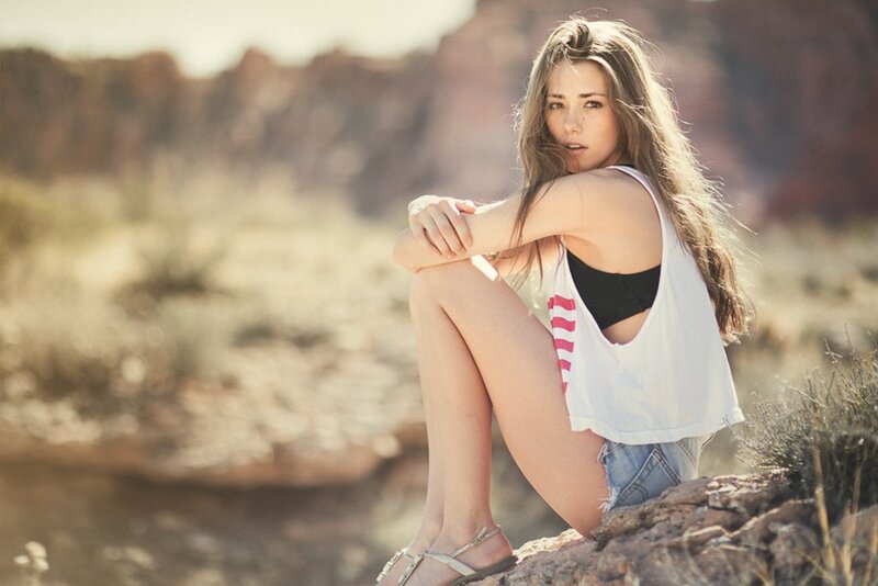 woman sitting in desert landscape