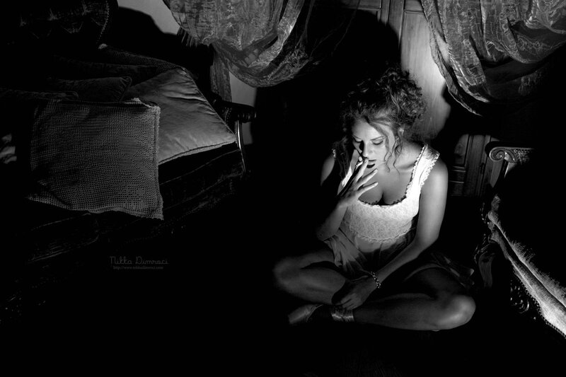 woman sitting in dim light