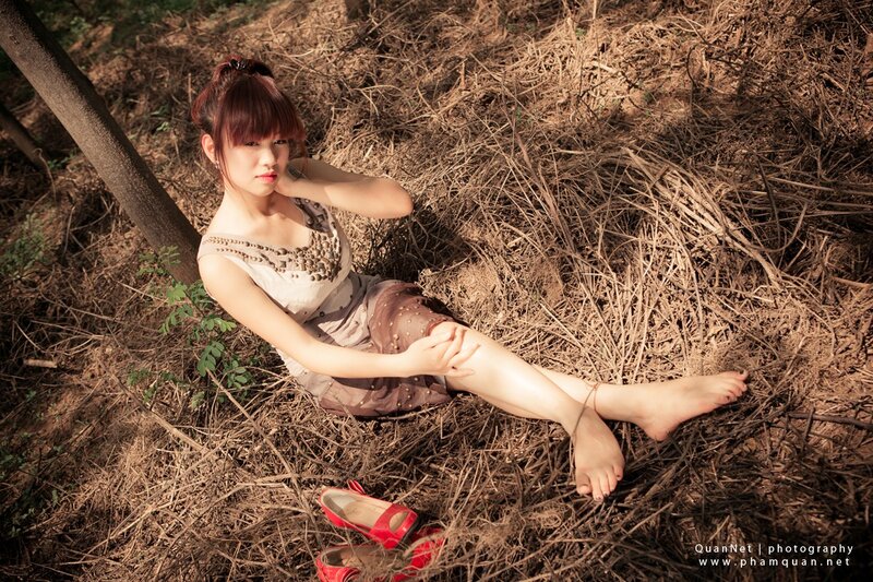 Woman Sitting in Dry Grass — Brown