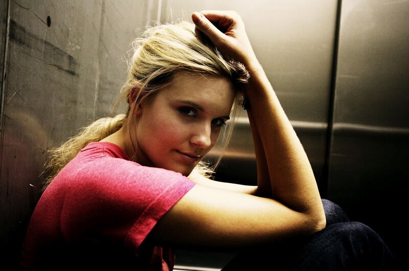 woman sitting in elevator
