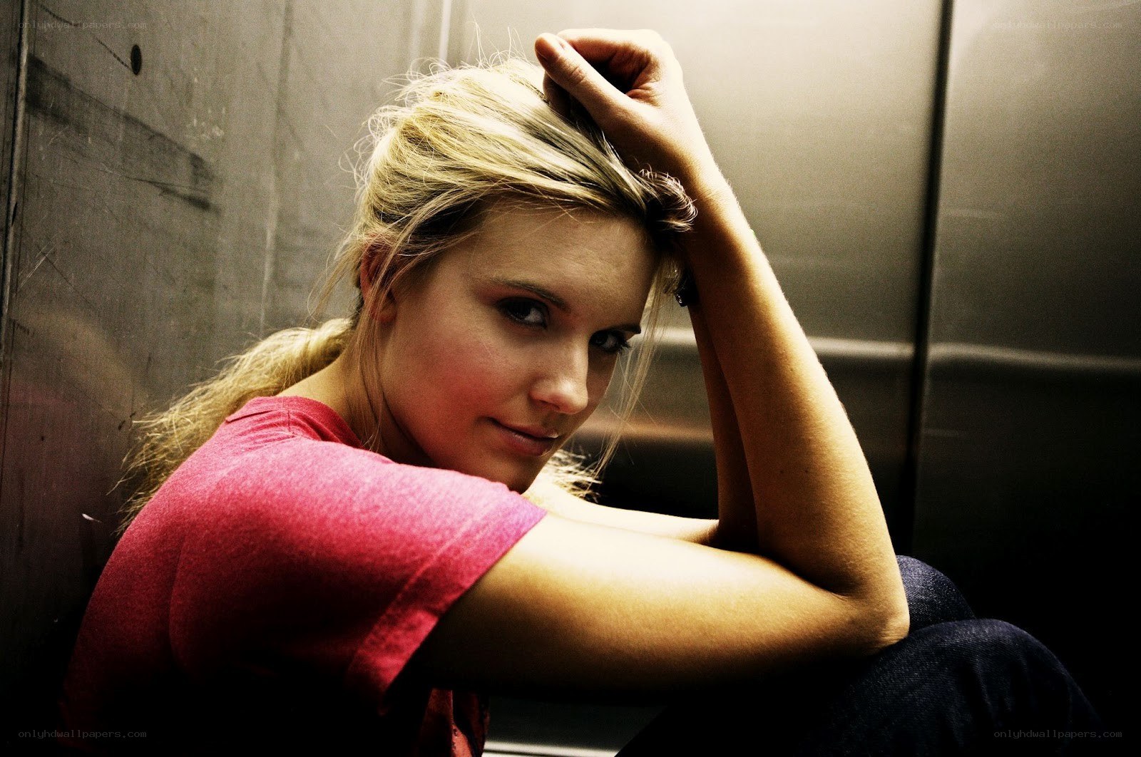woman sitting in elevator