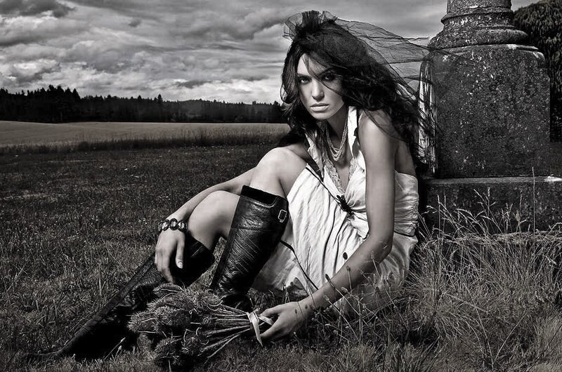 Woman Sitting in Field — Black