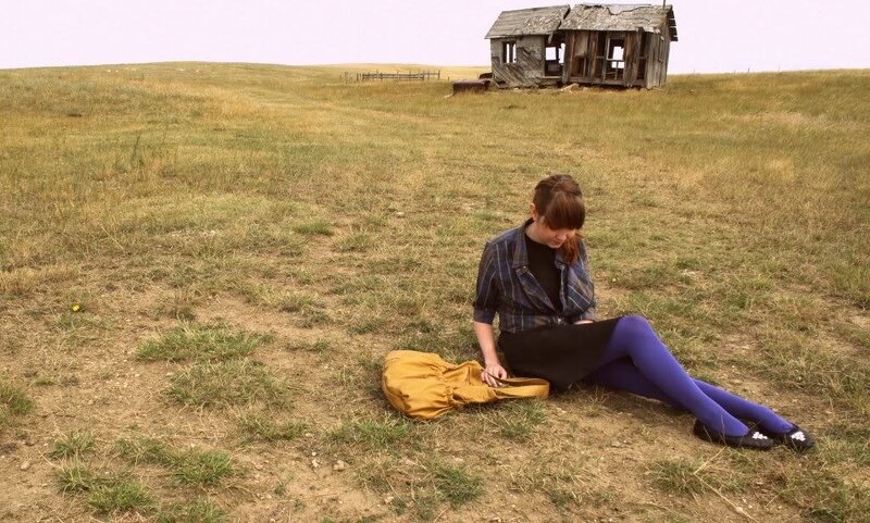 Woman Sitting in Field — Green