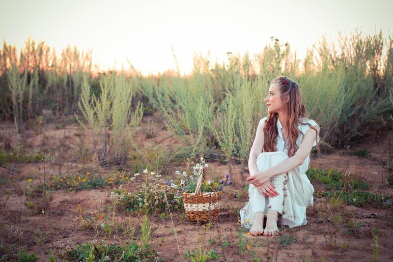 Woman Sitting in Field — White