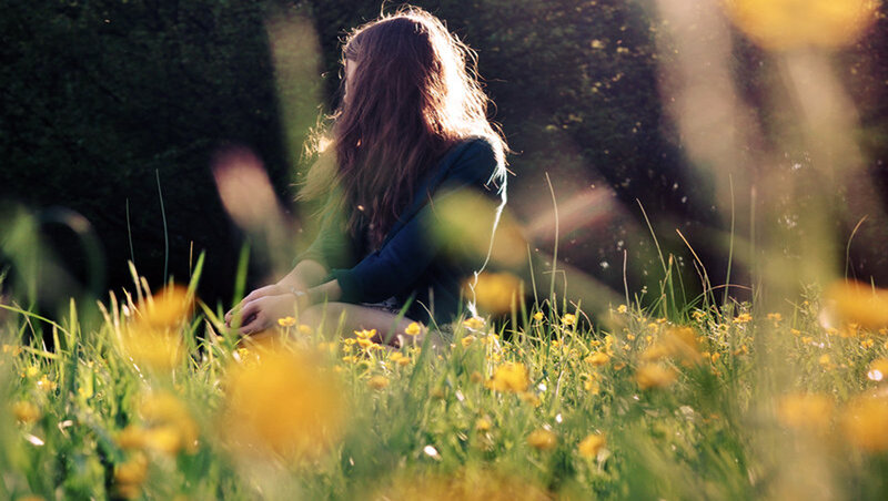 Woman Sitting in Field — Yellow, Serene