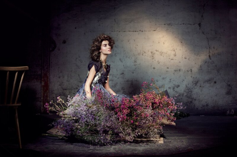 Woman Sitting in Flowers