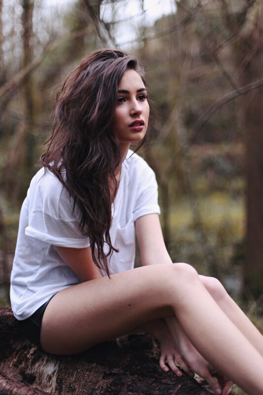 woman sitting in forest