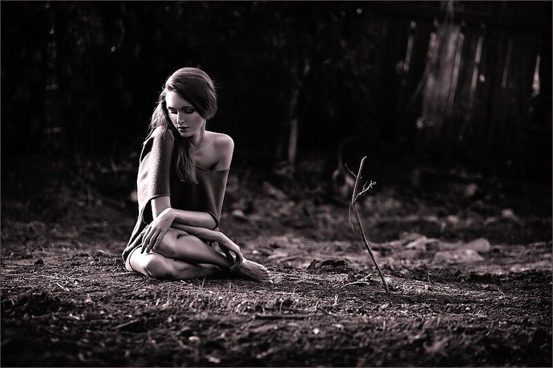 woman sitting in forest