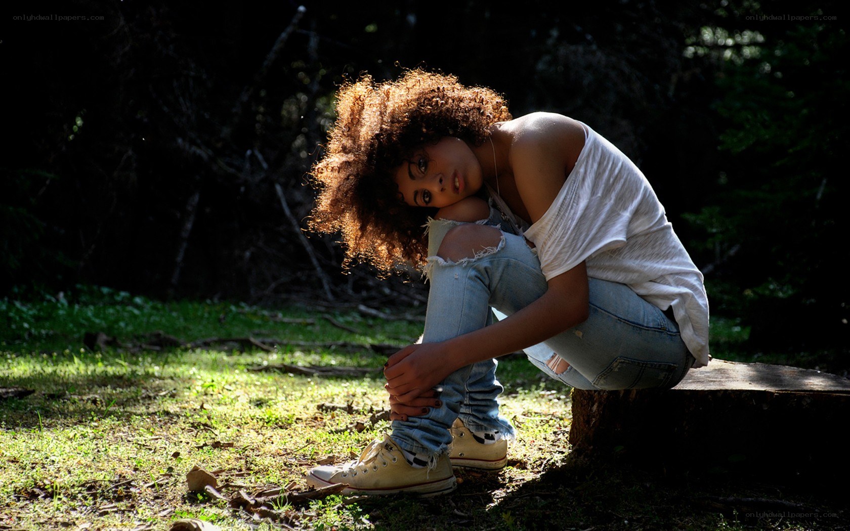 woman sitting in forest