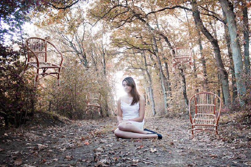 Woman Sitting in Forest — Brown, Serene